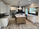 Open concept kitchen with island and stainless steel appliances at 568 Drumstand Rd, Stony Point, NC 28678