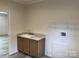 Laundry room with cabinets and shelving at 568 Drumstand Rd, Stony Point, NC 28678