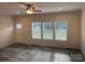 Bright living room featuring vinyl plank flooring and ceiling fan at 568 Drumstand Rd, Stony Point, NC 28678
