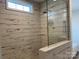 Walk-in shower with glass enclosure and tile surround at 568 Drumstand Rd, Stony Point, NC 28678
