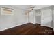 Bedroom with hardwood floors, ceiling fan, and ample closet space at 600 Thomas Trl, Gastonia, NC 28054