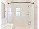 Updated bathroom with subway tile shower/tub combo and window at 716 Ellsworth Rd, Charlotte, NC 28211