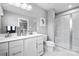 Elegant bathroom with double vanity, marble shower, and modern fixtures at 7315 Childress Sw Dr, Concord, NC 28025