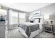 Bright bedroom with a queen bed, large windows, and grey color scheme at 7315 Childress Sw Dr, Concord, NC 28025