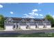 New townhome community with attached garages and landscaping at 7315 Childress Sw Dr, Concord, NC 28025