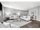 Light and airy living room featuring neutral decor and a cozy fireplace at 7315 Childress Sw Dr, Concord, NC 28025