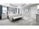Spacious main bedroom with gray walls, carpeted floors, and natural light at 7315 Childress Sw Dr, Concord, NC 28025