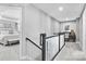 Upstairs landing with a built-in desk and view of the Primary bedroom at 7315 Childress Sw Dr, Concord, NC 28025