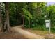 Paved walking trail through a wooded area at 7315 Childress Sw Dr, Concord, NC 28025