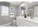 Double vanity bathroom with white cabinets and gray walls at 7329 Braswell Sw Dr, Concord, NC 28025
