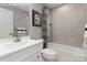 Clean bathroom with a shower/tub combo and white vanity at 7329 Braswell Sw Dr, Concord, NC 28025