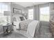 Bright bedroom with a double bed and large windows at 7329 Braswell Sw Dr, Concord, NC 28025