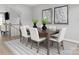 Formal dining room with a wood table and six white chairs at 7329 Braswell Sw Dr, Concord, NC 28025
