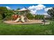 playground with slides, swings, and climbing structures at 7329 Braswell Sw Dr, Concord, NC 28025