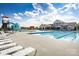Community pool with a waterslide and plenty of lounge chairs at 7329 Braswell Sw Dr, Concord, NC 28025