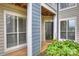 Condo building exterior with gray siding and a private entrance at 907 Southwest Dr, Davidson, NC 28036