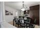 Bright dining area with glass table and four chairs, adjacent to kitchen at 907 Southwest Dr, Davidson, NC 28036