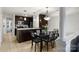 Kitchen and dining area with dark cabinetry and tile floors at 907 Southwest Dr, Davidson, NC 28036