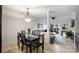 Dining area with glass table and living room view at 907 Southwest Dr, Davidson, NC 28036