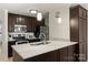 Modern kitchen with stainless steel appliances and marble countertops at 907 Southwest Dr, Davidson, NC 28036