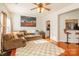 Living room with a fireplace, hardwood floors, and sectional sofa at 140 Rock Ridge Ln, Mount Holly, NC 28120