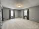Simple bedroom with carpet flooring and neutral walls at 142 Swink Sw St, Concord, NC 28027