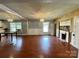 Open concept dining area with hardwood floors and a fireplace at 142 Swink Sw St, Concord, NC 28027