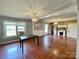 Open concept dining area with hardwood floors and a fireplace at 142 Swink Sw St, Concord, NC 28027