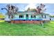 Charming ranch home with a covered porch and well-maintained lawn at 142 Swink Sw St, Concord, NC 28027