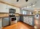 Updated kitchen with stainless steel appliances and stylish backsplash at 142 Swink Sw St, Concord, NC 28027