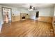 Spacious living room featuring hardwood floors and a fireplace at 142 Swink Sw St, Concord, NC 28027