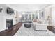 Living room featuring hardwood floors, a fireplace, and ample natural light at 16930 Turtle Point Rd, Charlotte, NC 28278