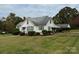 White house with carport and a well-maintained lawn at 1716 3Rd Ne St, Hickory, NC 28601