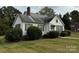 Side view of a white house with green landscaping at 1716 3Rd Ne St, Hickory, NC 28601
