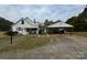 Front view of a house with carport and landscaping at 1716 3Rd Ne St, Hickory, NC 28601
