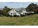White house with carport and spacious yard at 1716 3Rd Ne St, Hickory, NC 28601