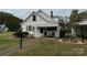 House exterior showcasing front porch and landscaping at 1716 3Rd Ne St, Hickory, NC 28601