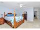 Well-lit bedroom with wooden post bed and access to hallway at 1811 Charter Dr, Rock Hill, SC 29732