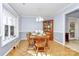 Charming dining room with hardwood floors and a built-in corner hutch at 1811 Charter Dr, Rock Hill, SC 29732