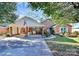 Brick ranch house with landscaped yard, covered carport, and walkway at 1811 Charter Dr, Rock Hill, SC 29732