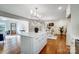 Open concept kitchen and living area with white cabinets and hardwood floors at 28461 Canton Rd, Albemarle, NC 28001