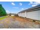 Three-car garage with gravel driveway and fenced yard at 4343 Bookout Rd, Rock Hill, SC 29730