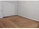 Spacious bedroom with double door closet and brown carpet at 7374 Sun Dance Dr, Fort Mill, SC 29707