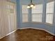 Charming dining area with light blue walls, tile flooring, and window access at 7374 Sun Dance Dr, Fort Mill, SC 29707