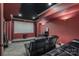 Spacious home theater with projector, tiered seating, and black leather reclining chairs at 9267 Egret Rdg # 41, Belmont, NC 28012