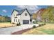 Two-story house with a gray roof and brick facade at 13900 Idlewild Rd, Matthews, NC 28105