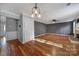 Dining room with hardwood floors and access to kitchen at 13938 Kings Carriage Ln, Charlotte, NC 28278