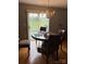 Small dining area with a round table and four chairs, near sliding doors at 4720 Meadowfield Rd # 38, Charlotte, NC 28215