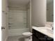 Bathroom with single vanity, tub, and shower at 533 Copes Ct, Kannapolis, NC 28081