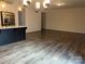 Open concept dining area with hardwood floors and modern lighting at 533 Copes Ct, Kannapolis, NC 28081